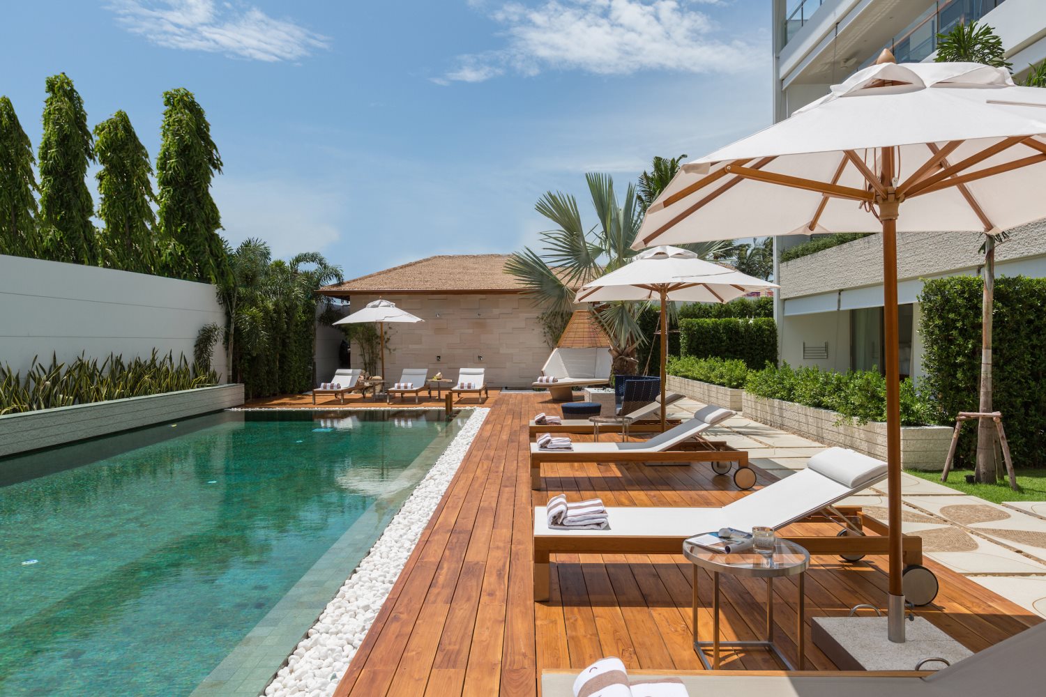 Pool with parasols and loungers